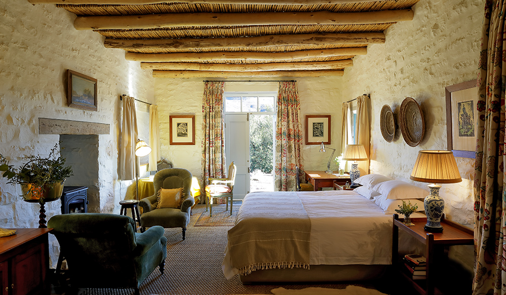 De Kruis bedroom, open door leading to garden Perfect Hideaways, De Kruis, Tankwa Karoo, Northern Cape, South Africa. Photo: Henrique Wilding