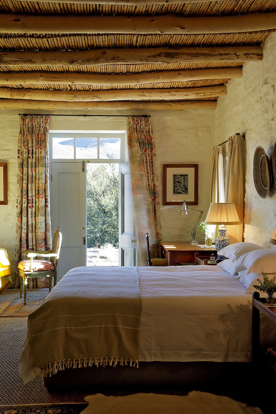 De Kruis bedroom, open door leading to garden Perfect Hideaways, De Kruis, Tankwa Karoo, Northern Cape, South Africa. Photo: Henrique Wilding