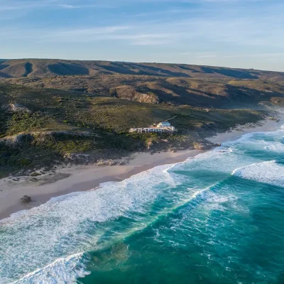 Lekkerwater beach lodge perched on De Hoop's nature reserve with a rugged landscape that meets the long stretch of coastline.