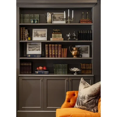 Charcoal wooden bookshelf with books and ornaments. Labotessa Hotel.