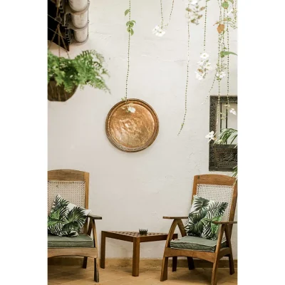 Peponi Hotel entrance hallway with two wicker armchairs and tropical decor.