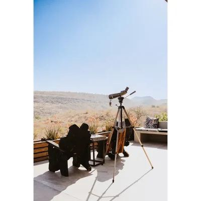 Outdoor patio with lounging space and a telescope facing the expansive Limpopo bushveld. The Blogck.