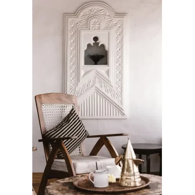 Corner wicker chair and a tray of tea. Peponi Hotel.