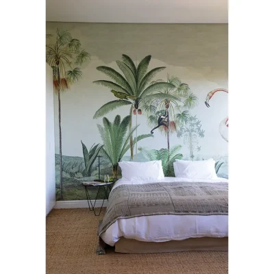 Double bed with crisp, white linen and tropical wallpaper in Pinebeach bedroom.